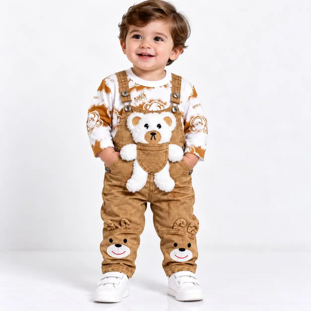 Baby boy wearing camel brown teddy bear dungaree set with printed shirt