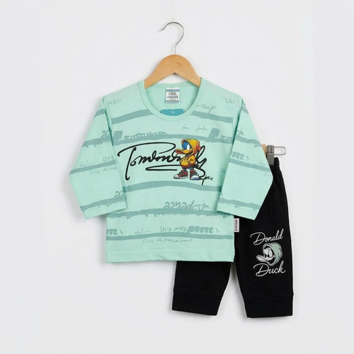 A children's two-piece outfit set featuring a mint green long-sleeve top with a cartoon graphic and black pants, displayed on a wooden hanger against a white background.